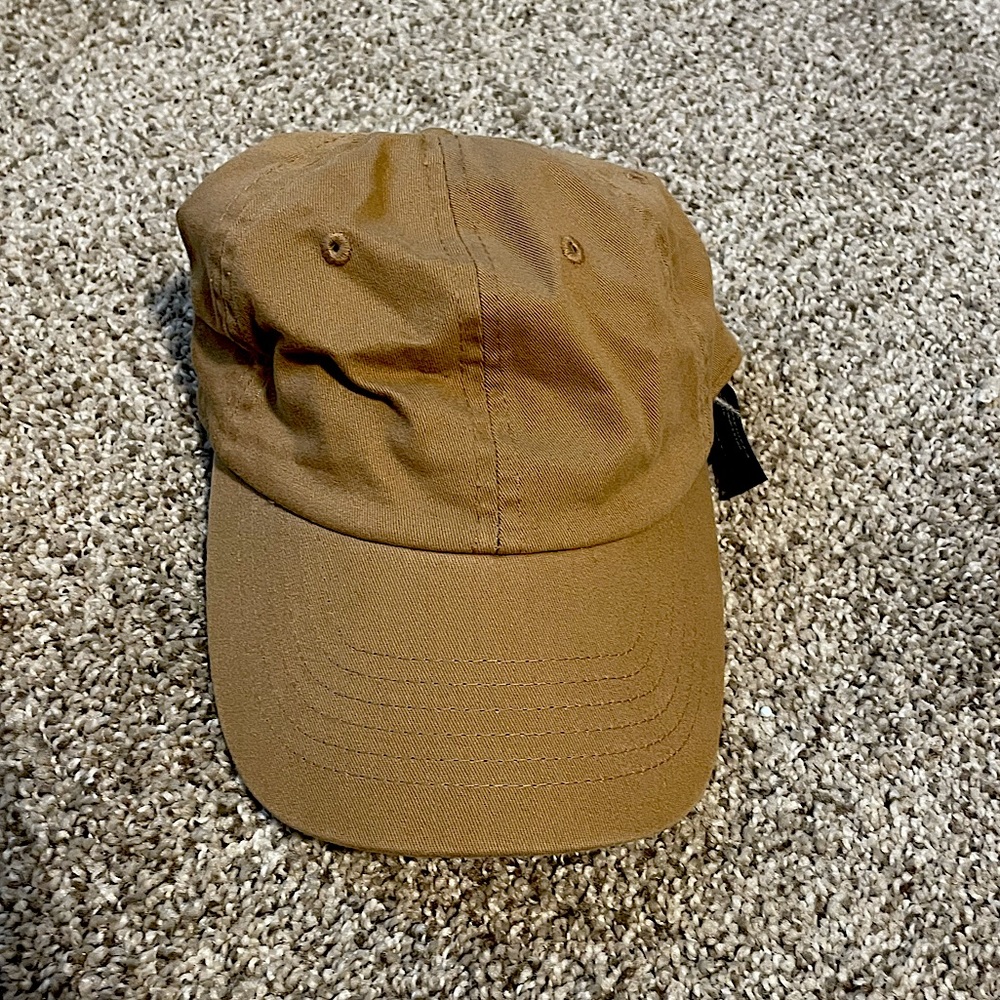 Women’s tan hat, one side fits all.